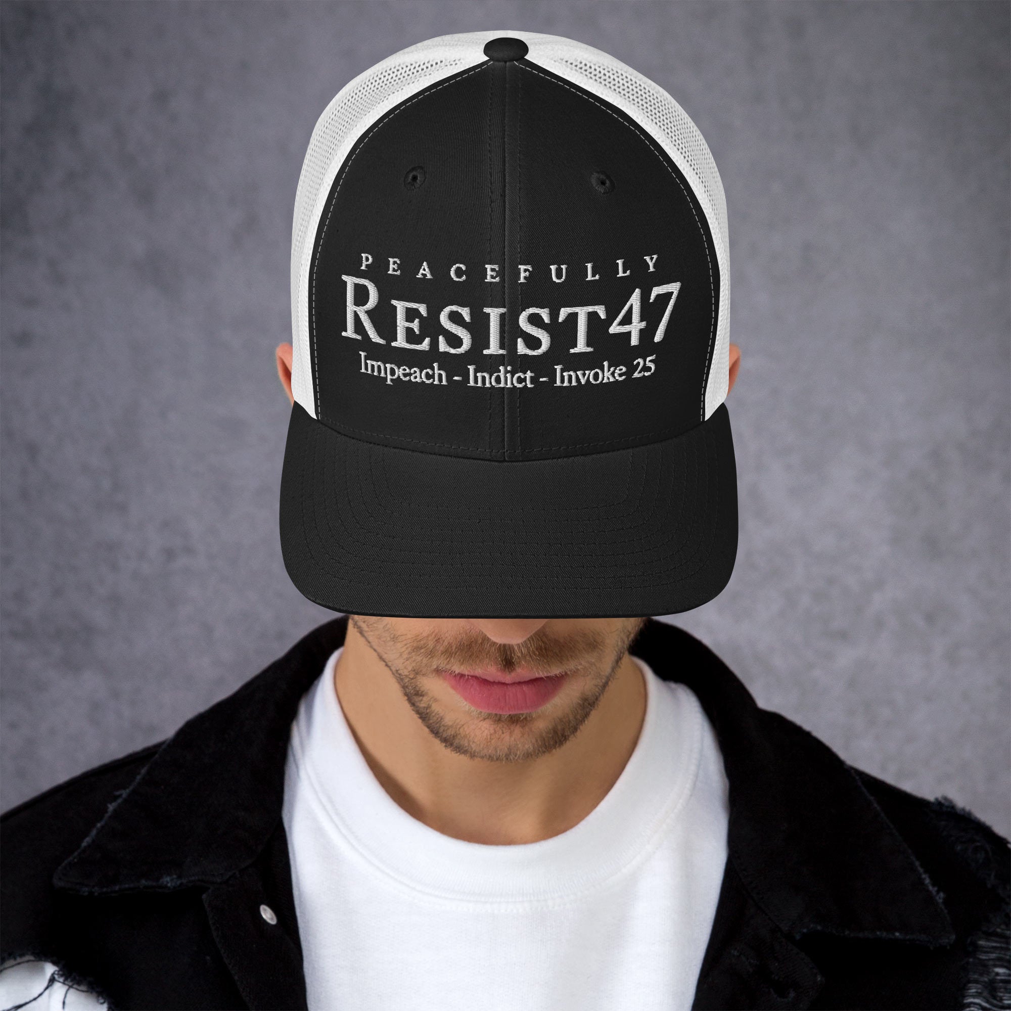 Charcoal/ Black cap with “Resist47 Protest” graphic, front view