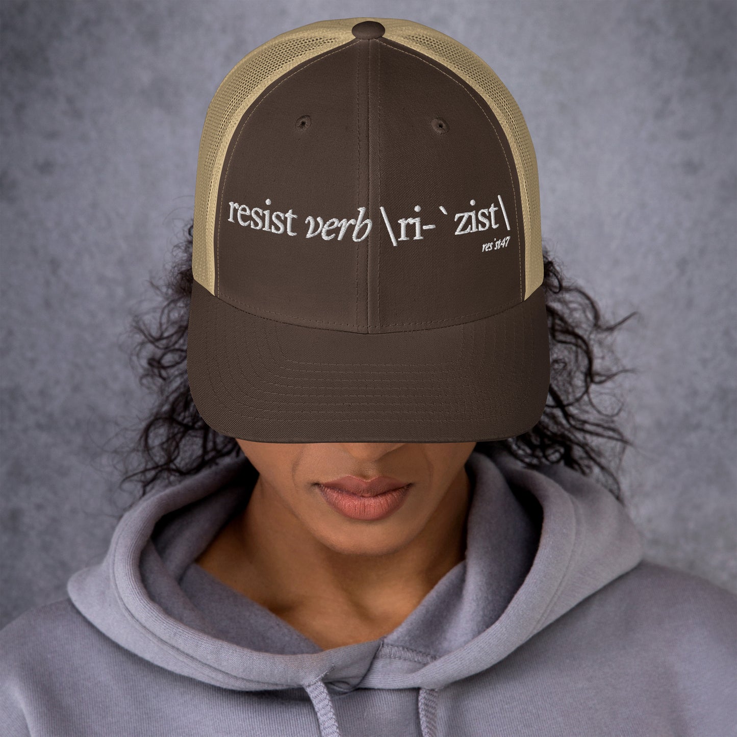 Silver cap with “Define Resist - Baseball” graphic, front view