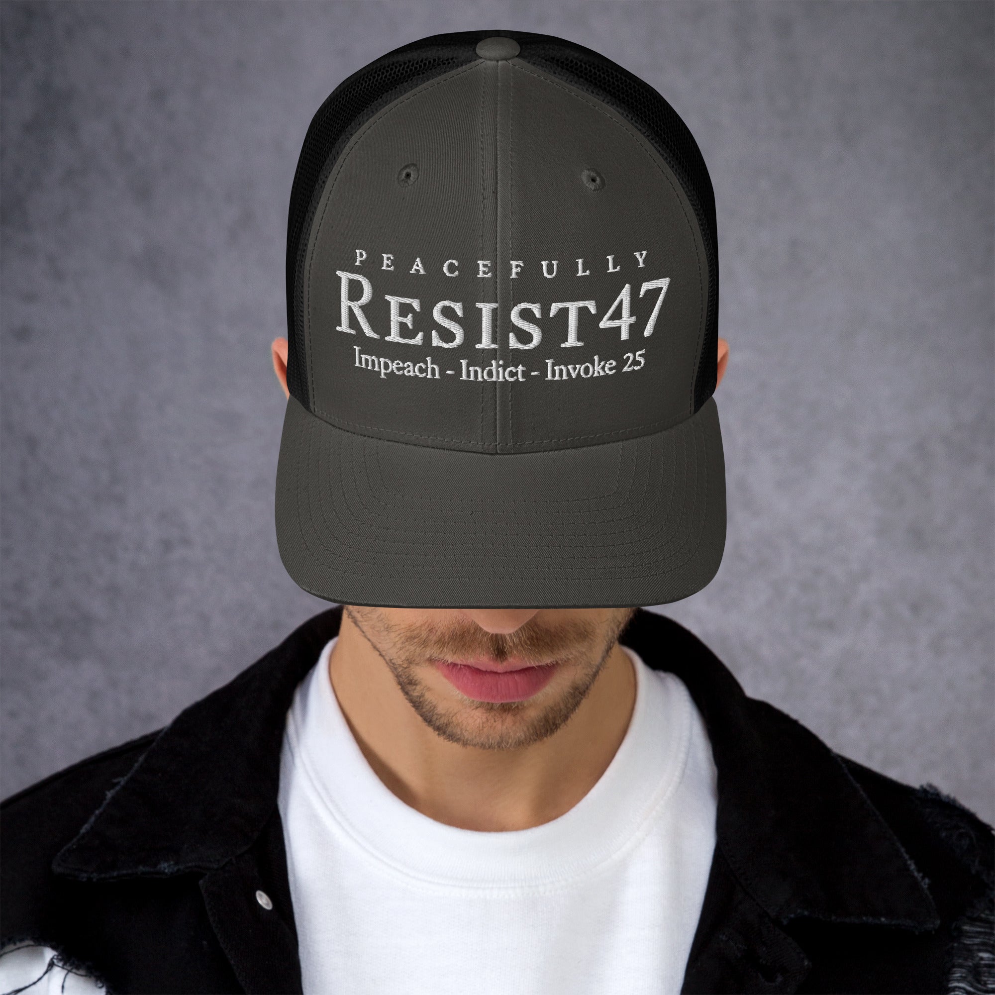 Evergreen cap with “Resist47 Protest” graphic, front view