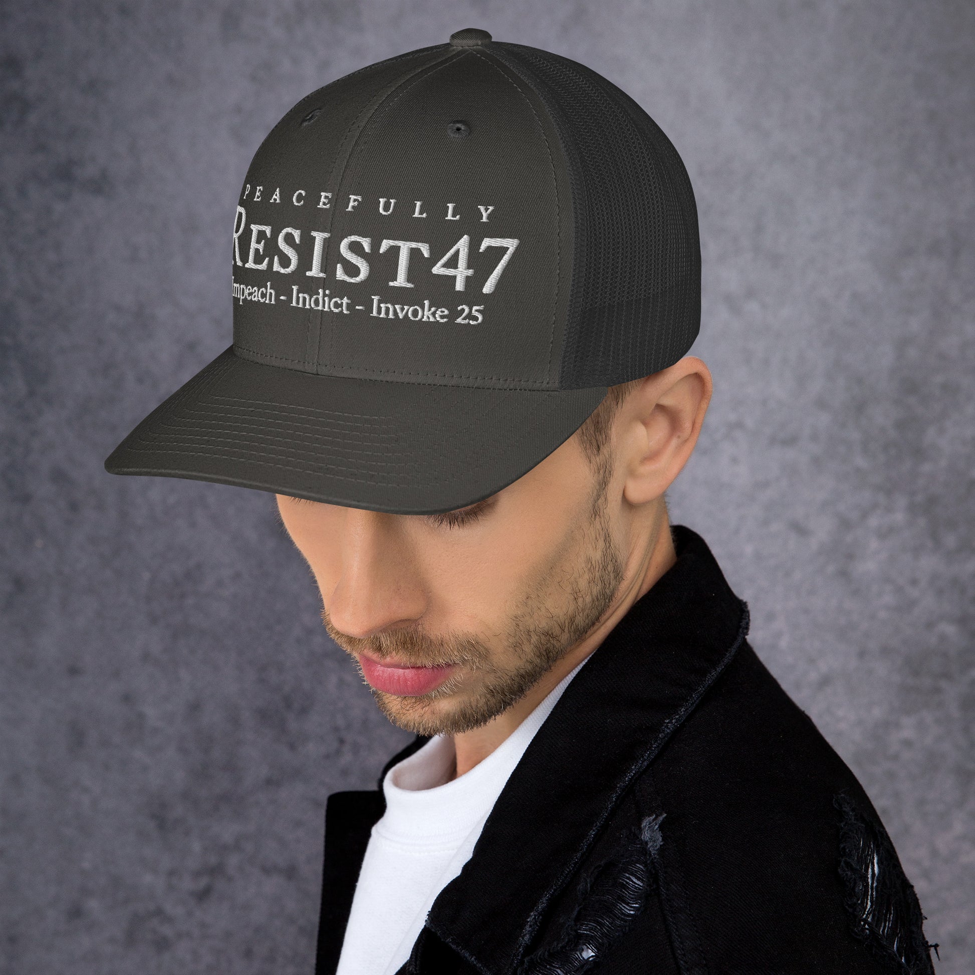 Pink cap with “Resist47 Protest” graphic, front view