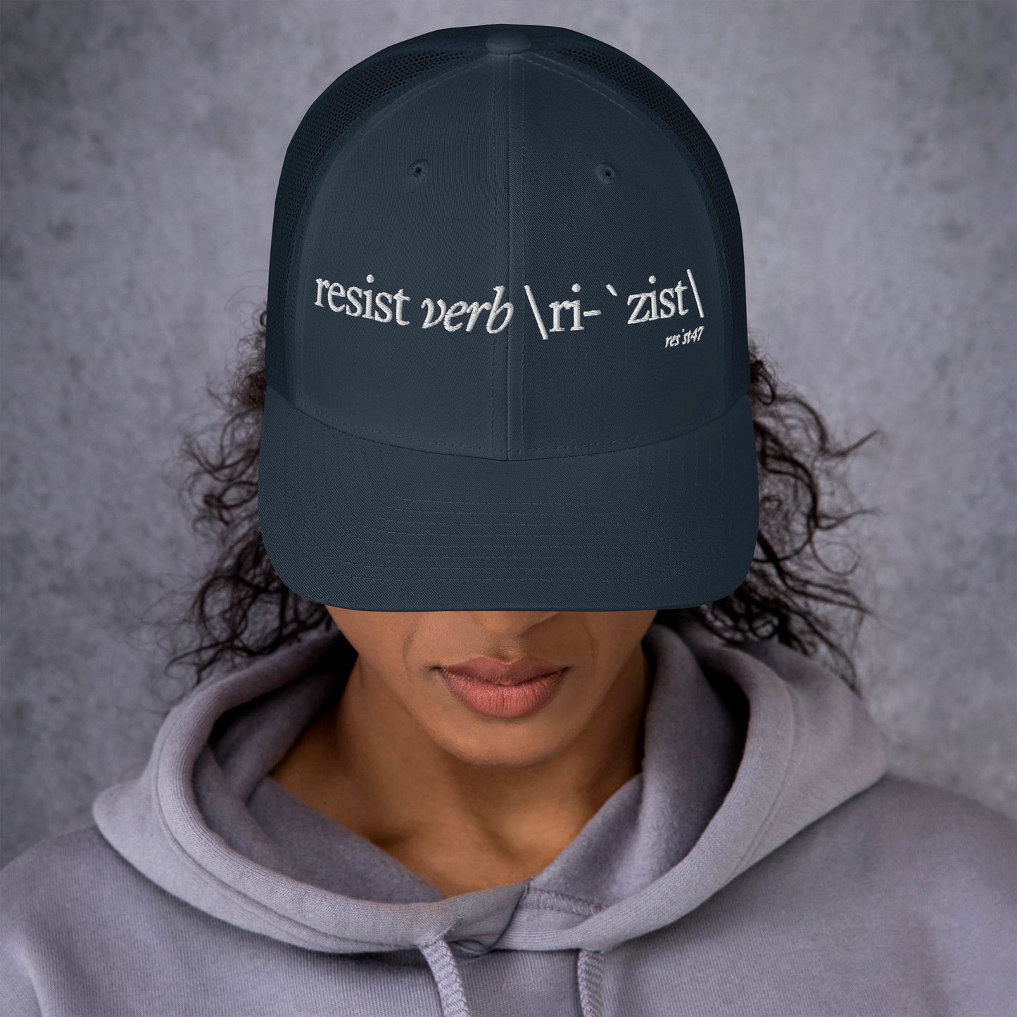 Charcoal/ Black cap with “Define Resist - Baseball” graphic, front view