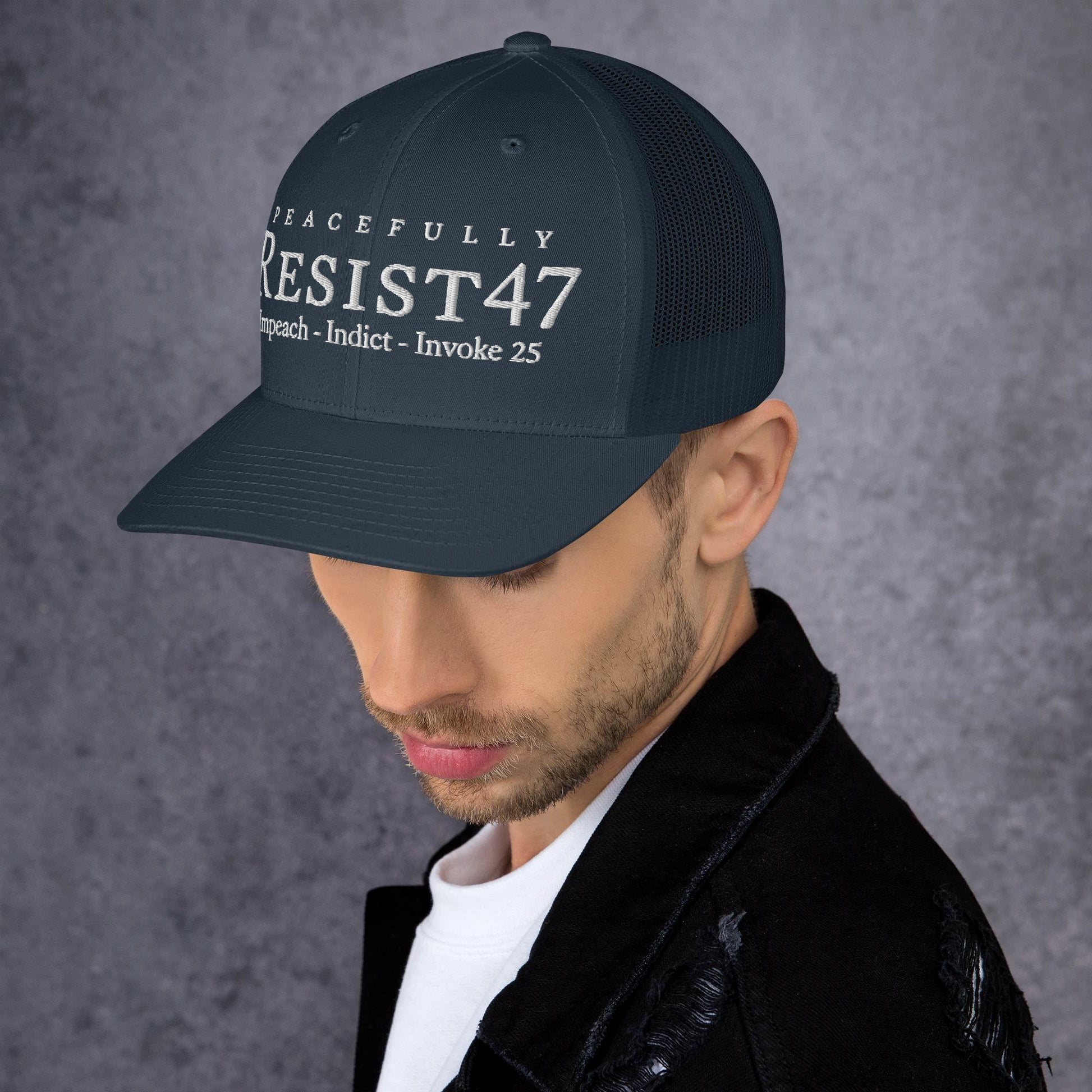 Red cap with “Resist47 Protest” graphic, front view