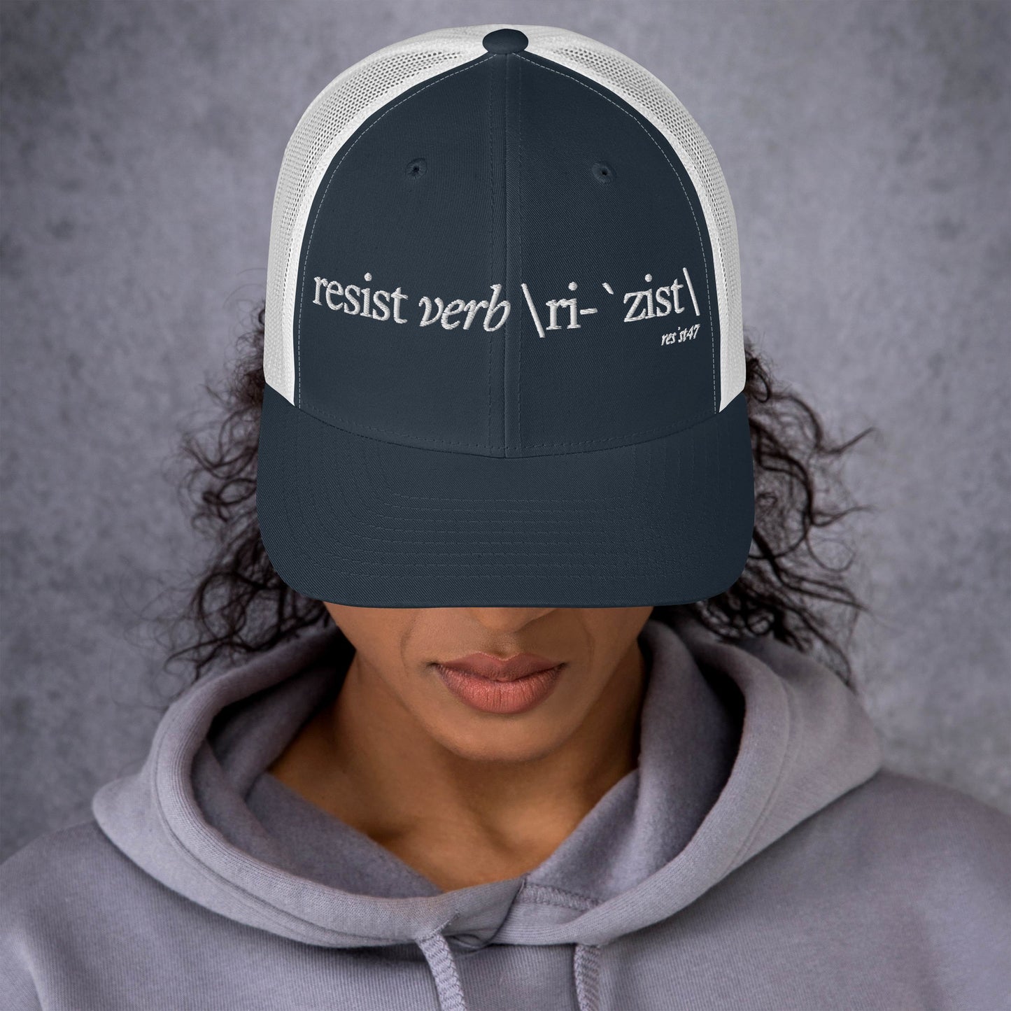 Cranberry cap with “Define Resist - Baseball” graphic, front view