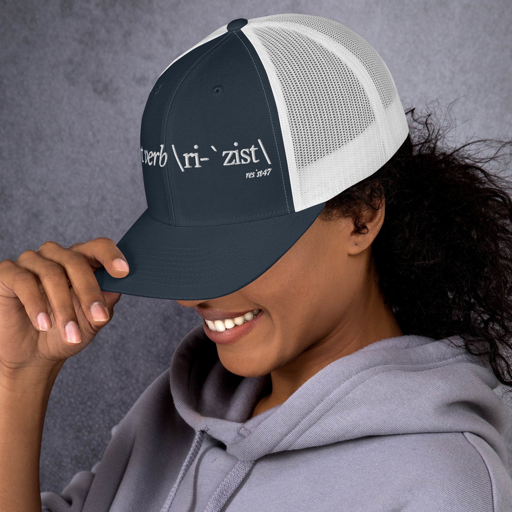 Red cap with “Define Resist - Baseball” graphic, front view
